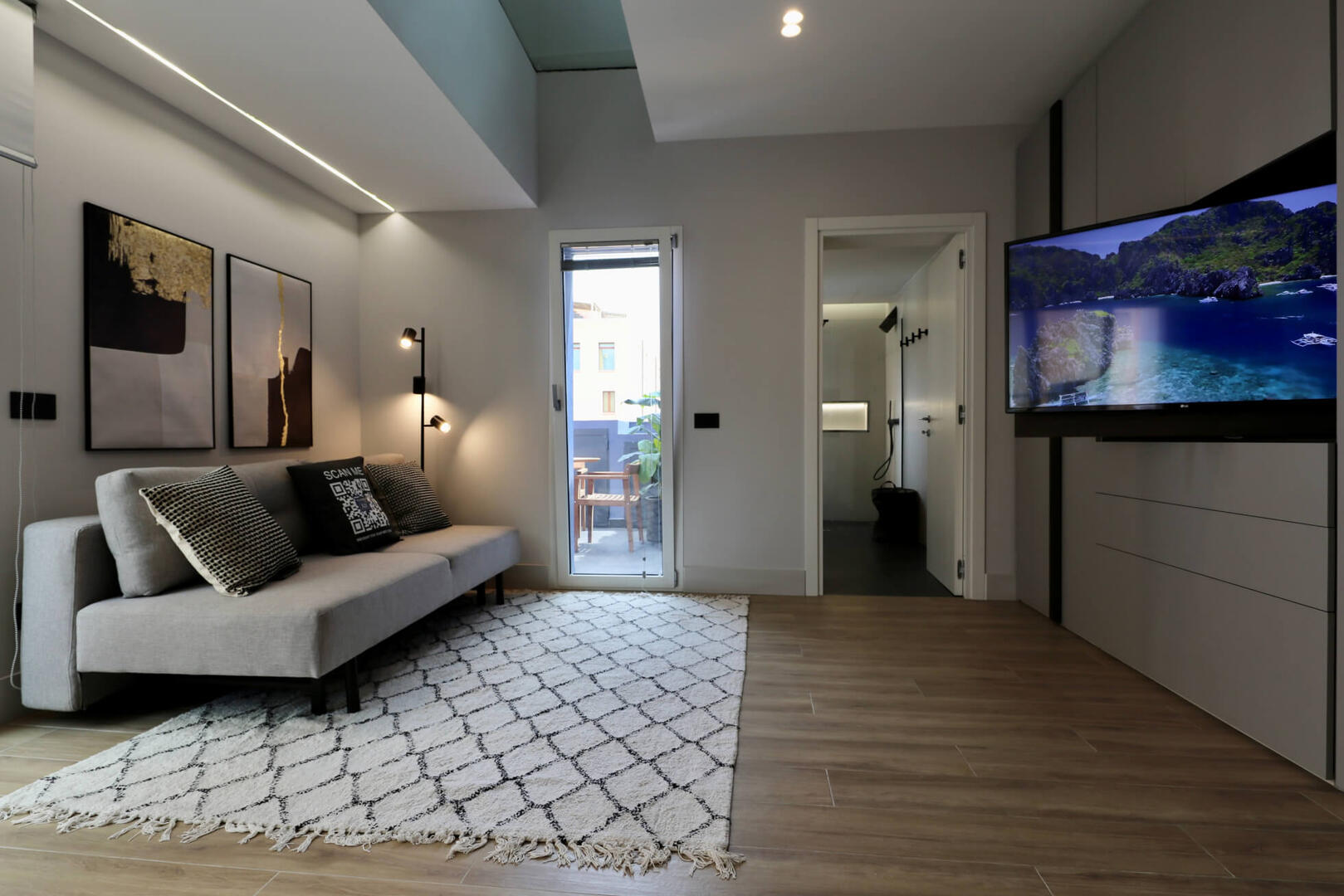 Fantastic living area with a comfy 2-person sofa bed and an exit to the large terrace.